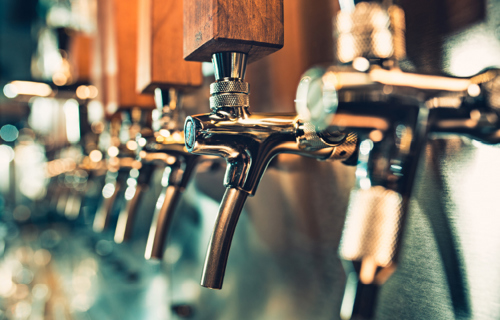 A row of pub taps shown in profile