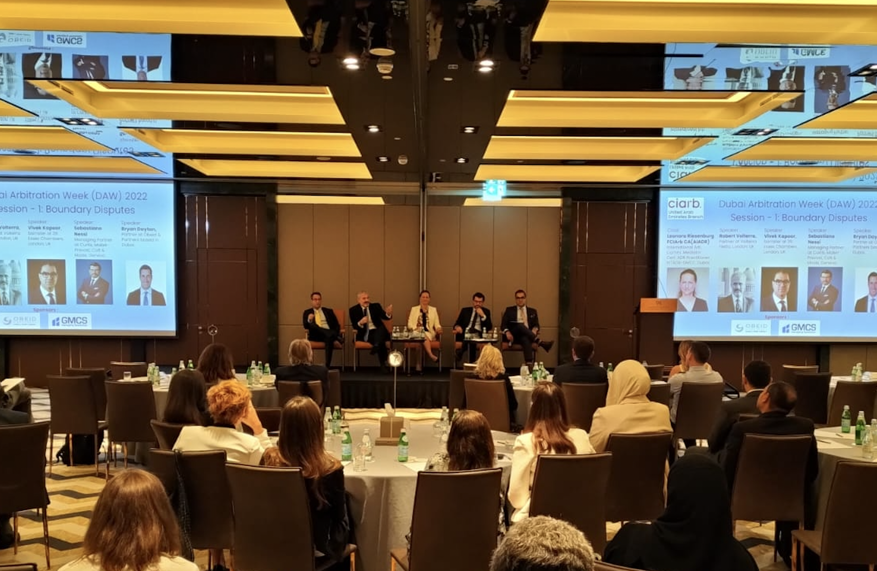 Photo taken at the ciarb UAE branch conference showing speakers and presentations